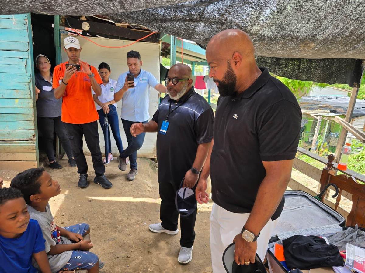 Bishop Richard serving children during humanitarian outreach