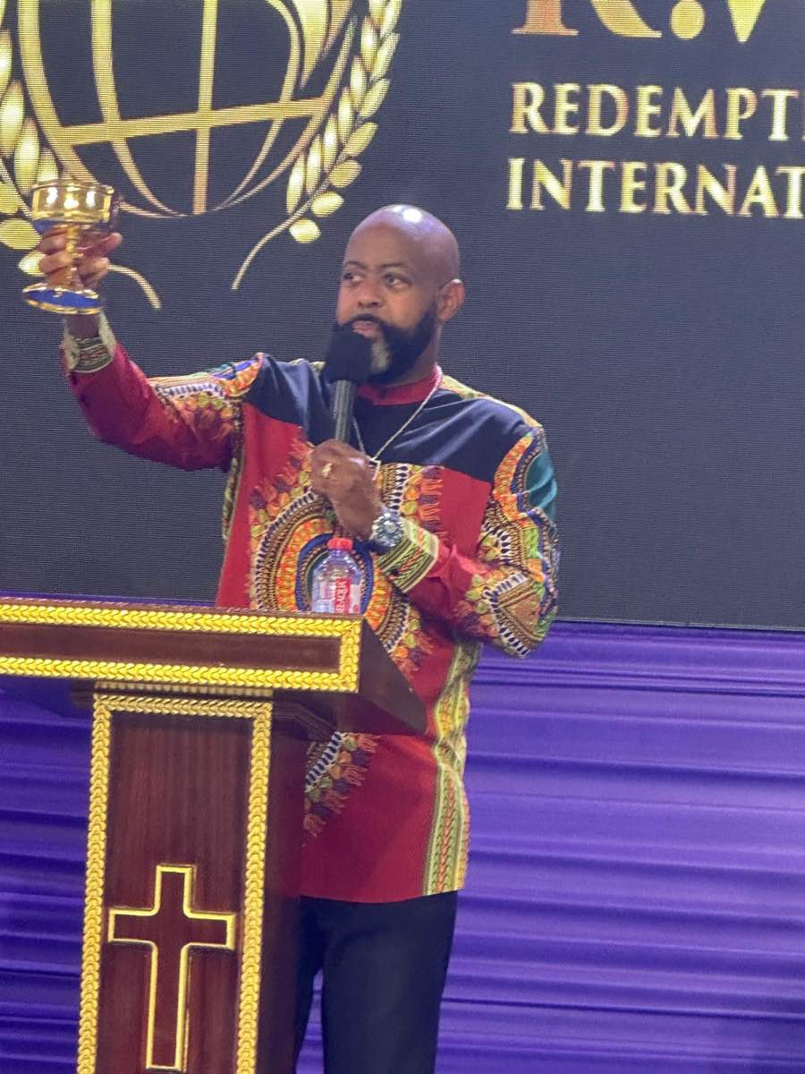Bishop Richard preaching and serving communion